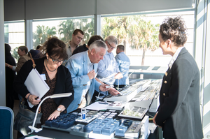 Members looking at diamonds at work conference